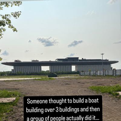 Someone thought to build a boat building over 3 buildings and then a group of people actually did it… I think this is a hotel lmao